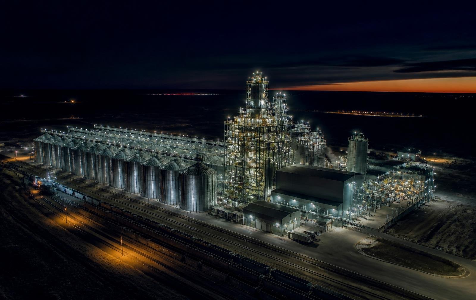 Patriot Oil Mills crush facility lit at night on the prairies